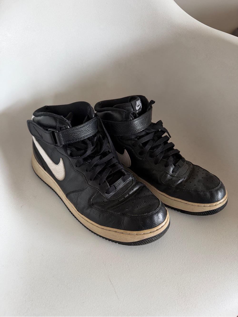 Nike Black Leather High-Top Sneakers with White Swoosh